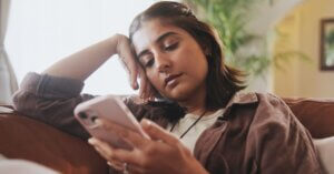 woman scrolling phone